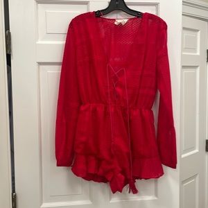 Jetset red long sleeved romper